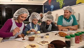 Parents with child in chocolate lab