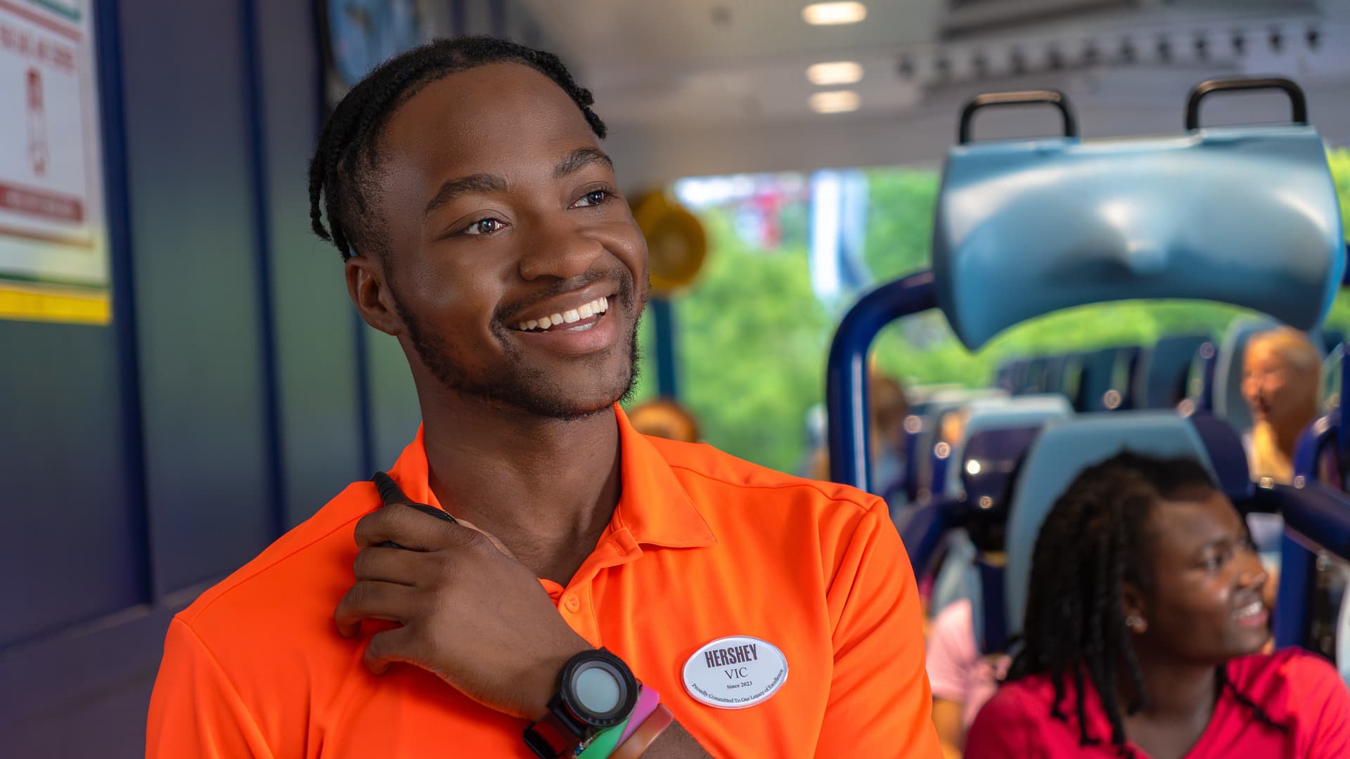 hersheypark employee smiling while on walkie talkie