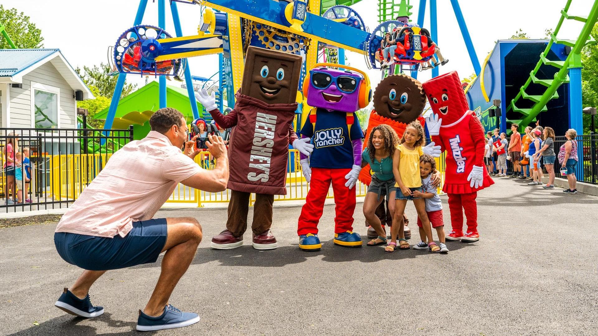 family taking picture with hersheys characters