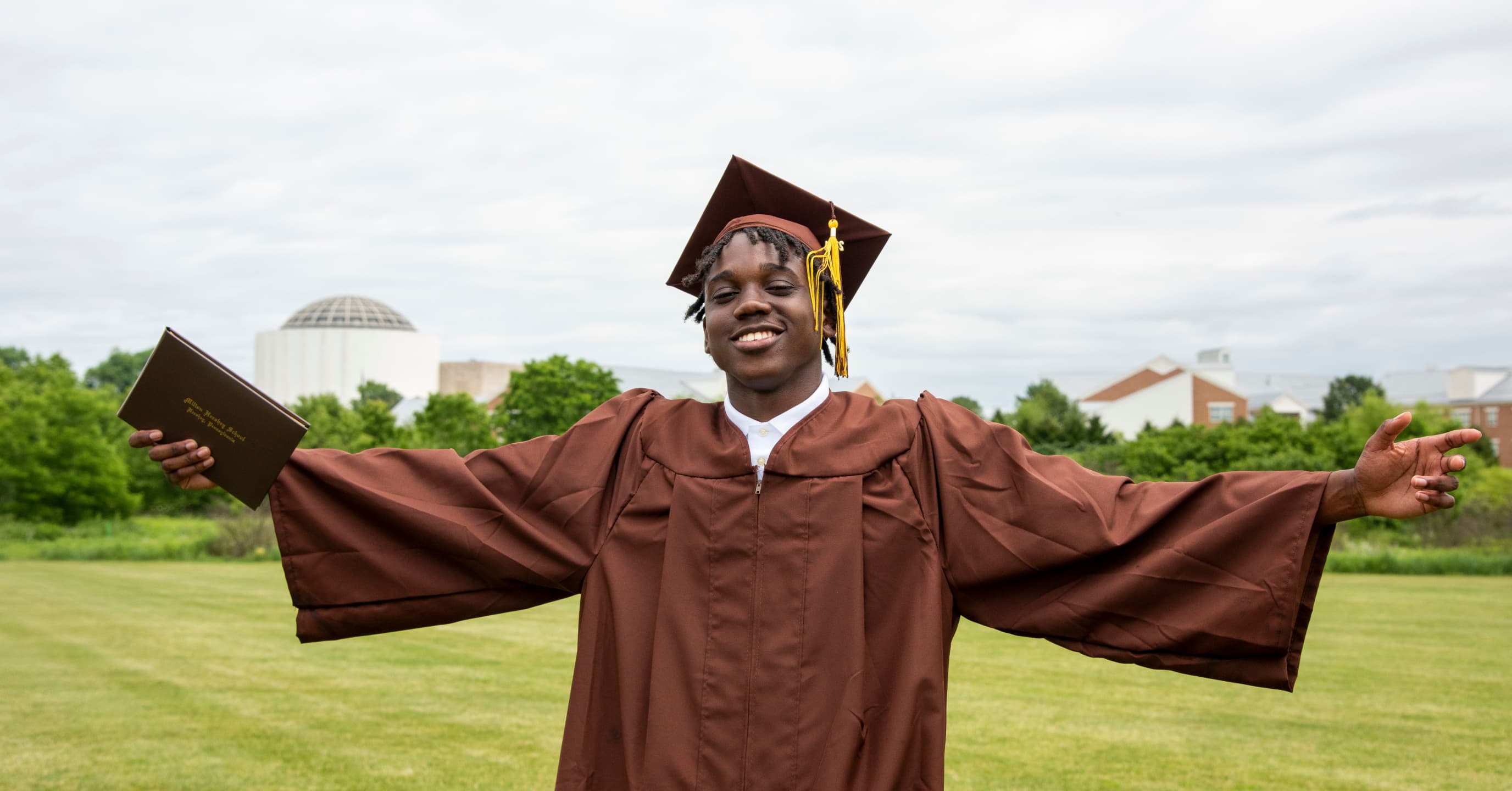 milton hershey school student wearing a cap and gown